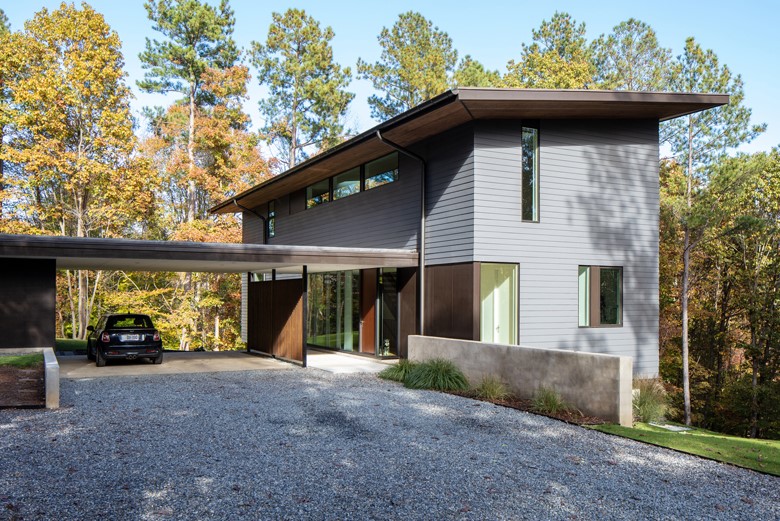 The architects from Raleigh nestled the home into a hillside 100 feet up, to preside over a lake view outside Charlotte. © Keith Isaacs Photo