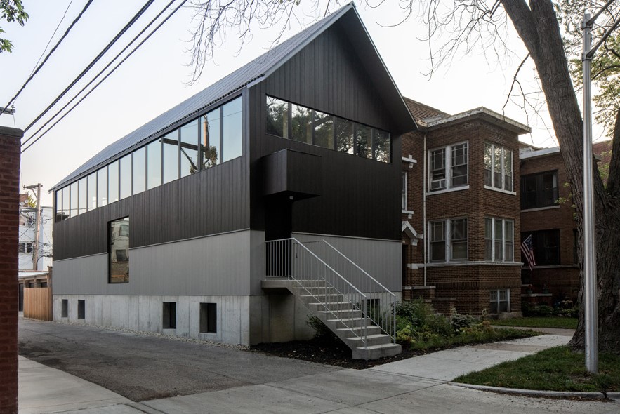 The architects flipped the traditional arrangement of placing living space on the ground level and private space atop.